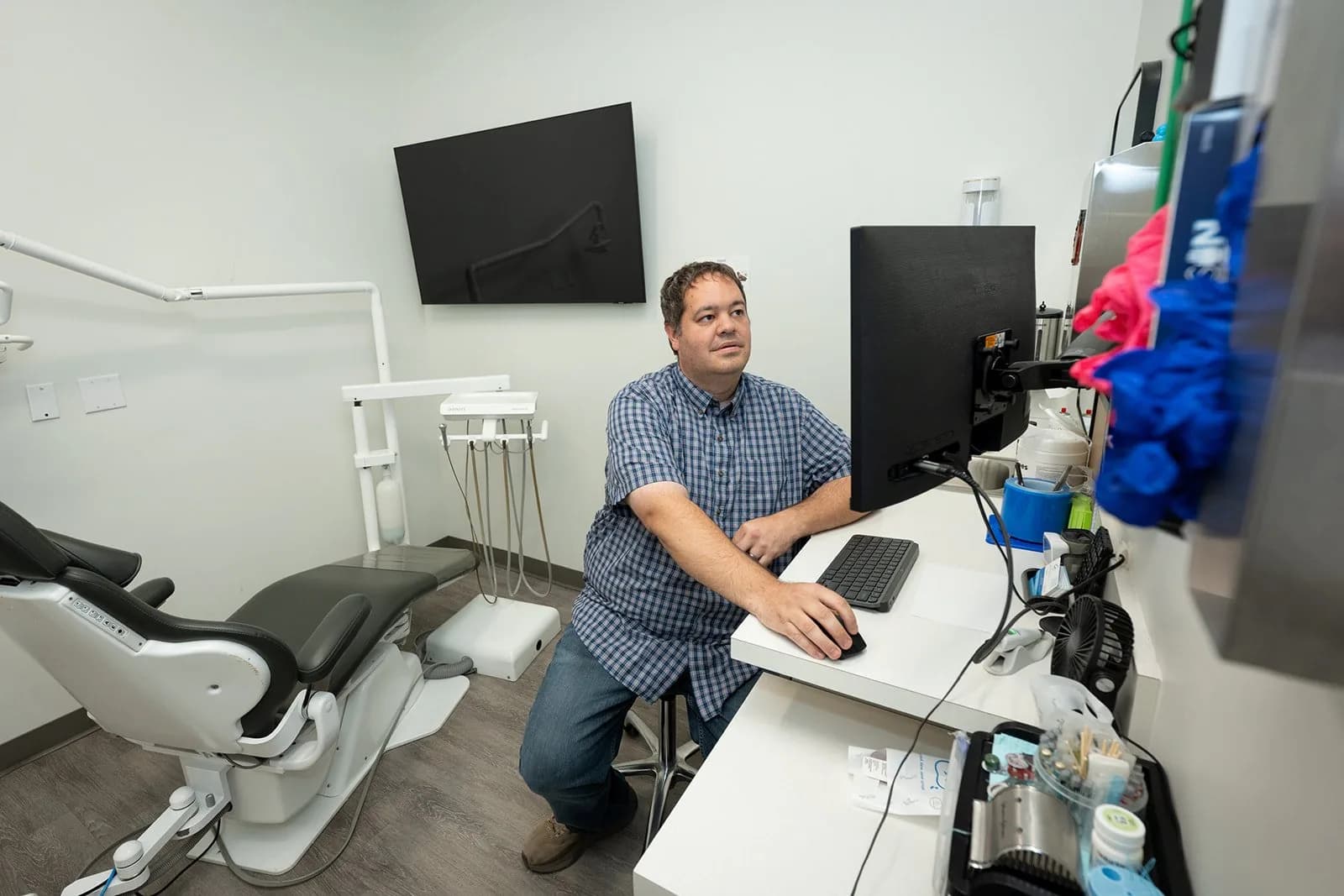 Ryan at work in a treatment room in one of his practices